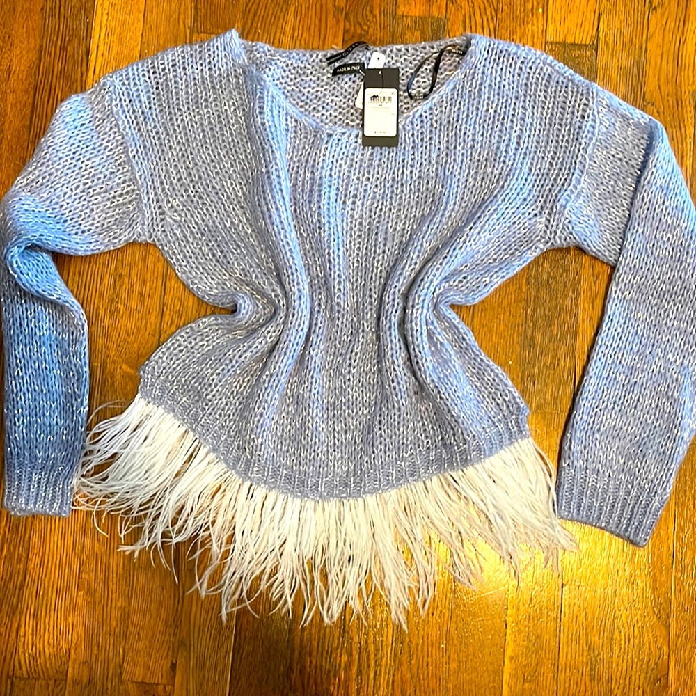 Sweater with feather triming.